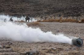 Members of the Chemical Smoke Platoon laying down smoke and obscurants during battles at the National Training Center at Fort Irwin, California.  Biography of Dr. Anthony J. Carbone.