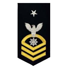 U.S. Navy Chief Petty Officer Supply Corps rank/rating sleeve insignia.  Biography of Dr. Anthony J. Carbone.